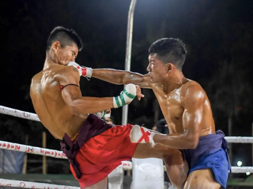 Lethwei bare-knuckle action in a traditional outdoor ring
